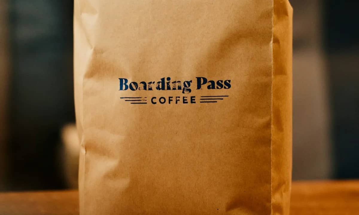 A paper coffee bag with a visible front label, illustrating the kind of package details buyers inspect before purchasing